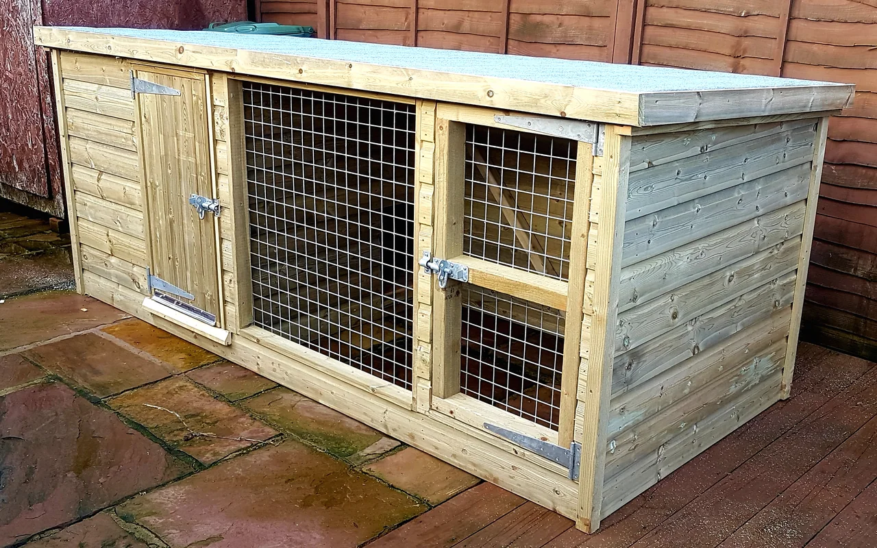 A timber animal enclosure with a boarded sleeping compartment and a mesh-fronted run